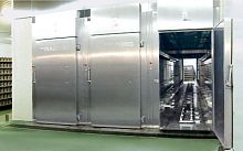 Automated transfer system for trolleystransportfor the food industry