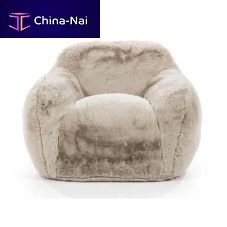 Contemporary armchair HUGvelvetbeigeliving room