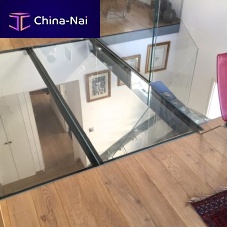 Structural floor with girder-slab lacquered steelstainless steeltempered glass