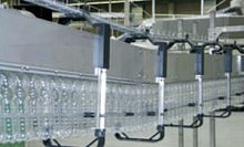 Overhead conveyor for PET bottles