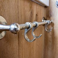 Contemporary coat hook GESLOTEN white bronzeraw metalaged iron