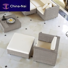 Contemporary armchair PACIFIC fabricresin wickerwith footrest